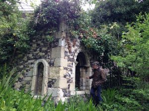 stone and flint mini tower with arched window