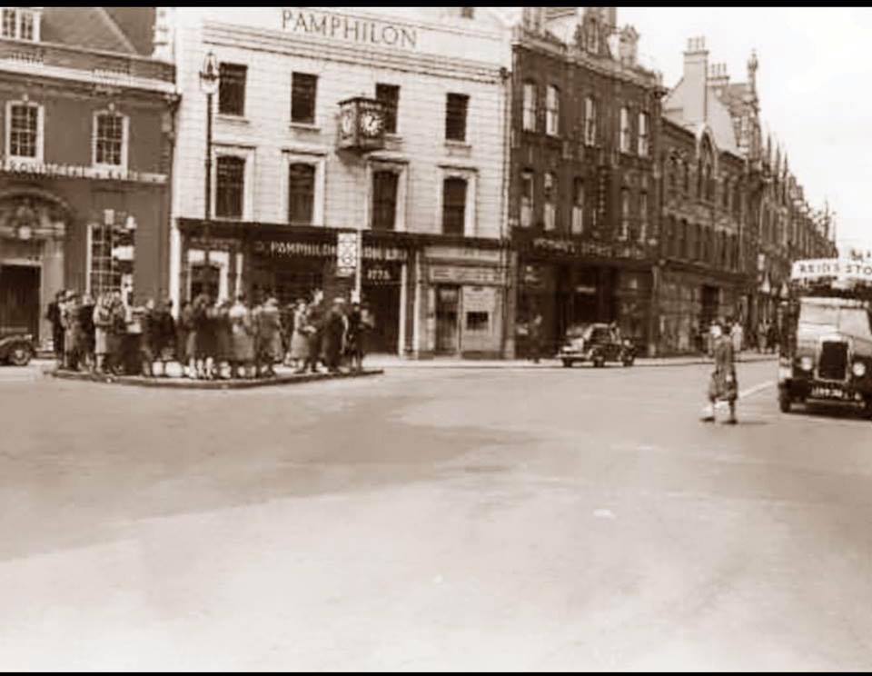 old street scene with 1940s ladies on traffic island