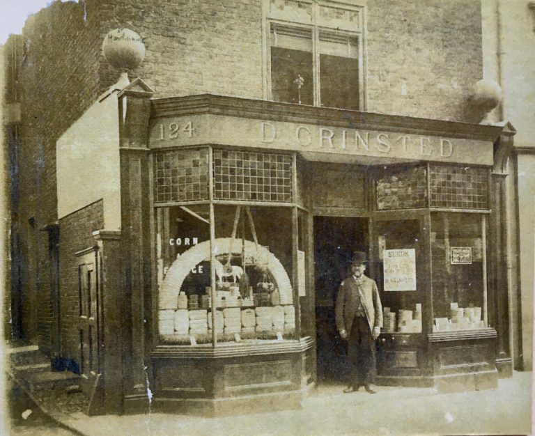 shopkeeper and old fashioned double shop front