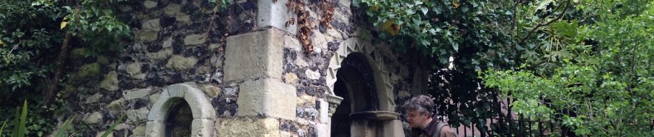 stone and flint mini tower with arched window