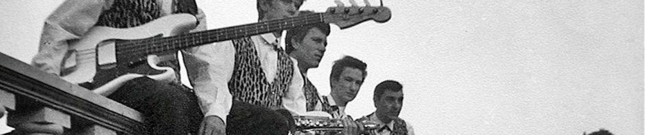 group of 1960s teens sitting on ballustrade