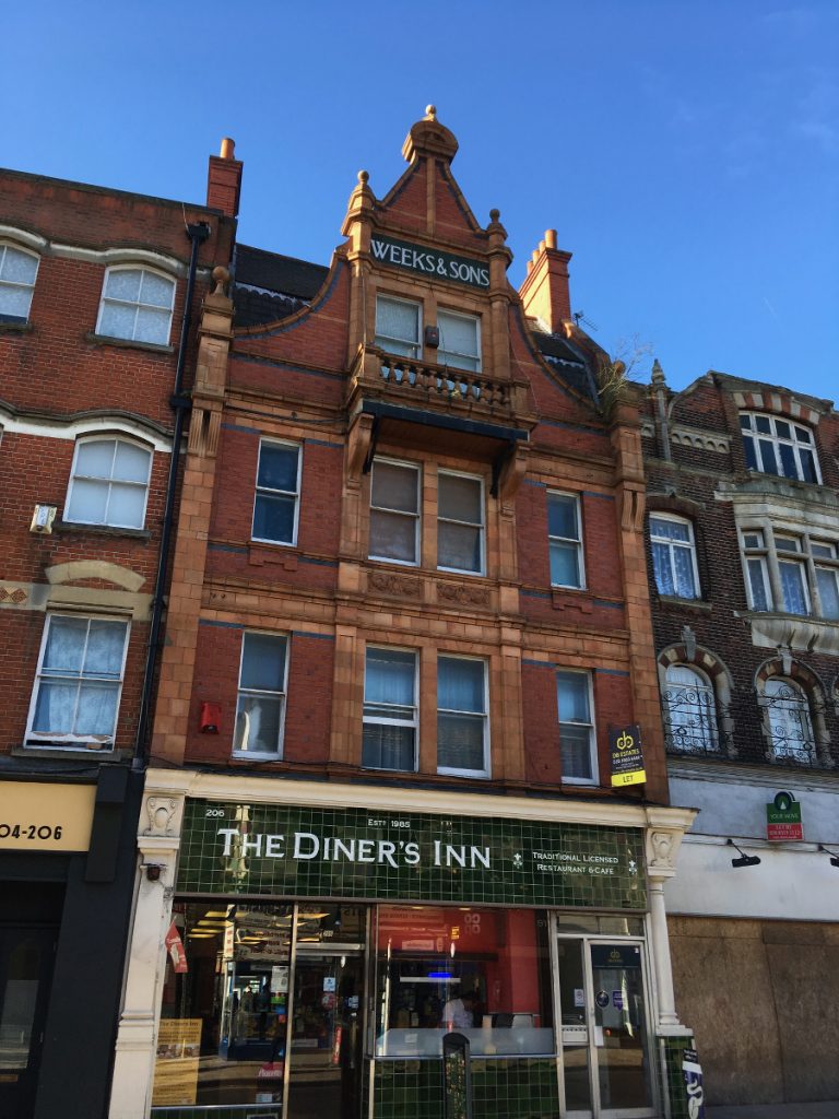 3 storey brick shop with gable front